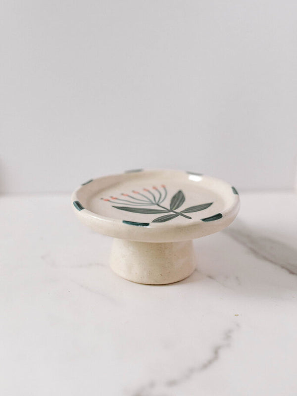 stoneware floral footed dish with blue edge