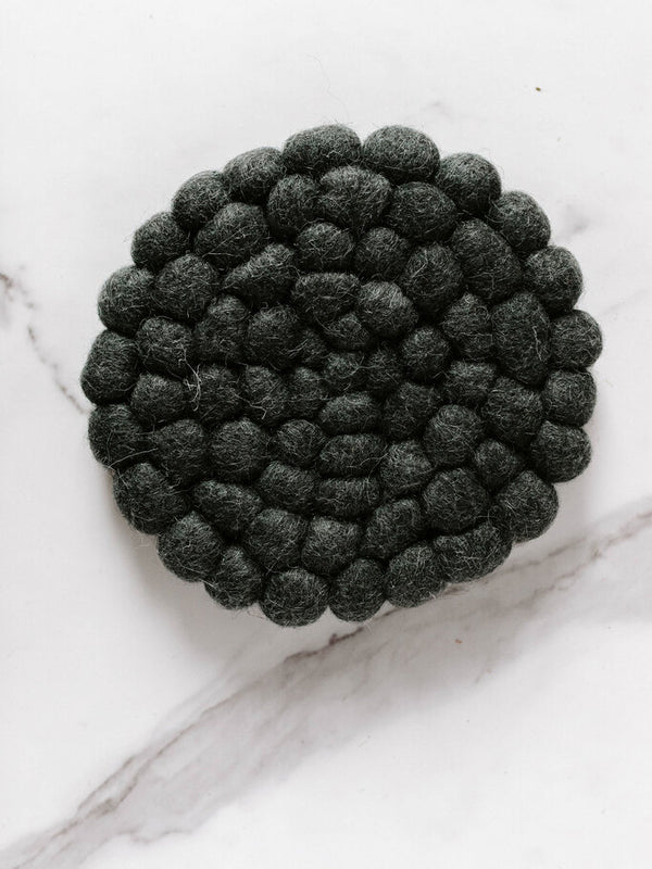 blue round felt ball trivet