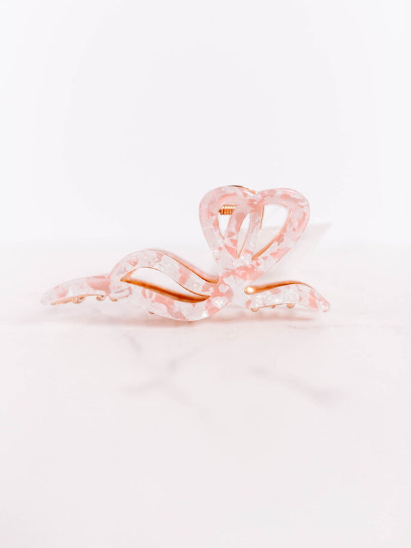 pink patterned bow hair claw