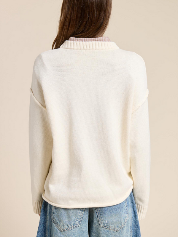 ecru sweater with ribbed crew neckline and ribbed sleeve cuffs