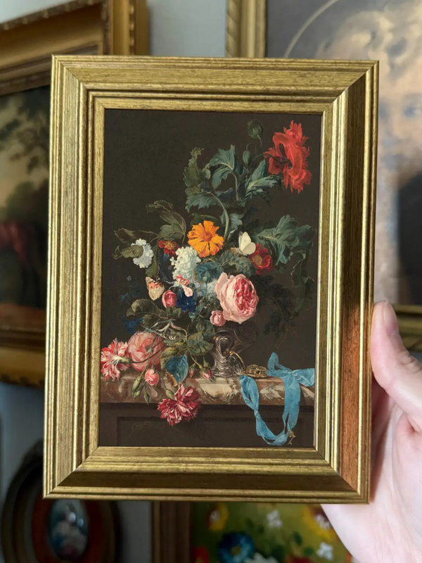 vintage style moody flowers in a vase art print in a frame