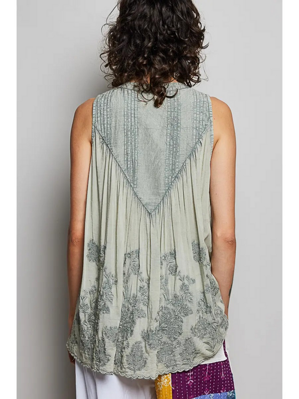 gray sheer sleeveless top with floral details