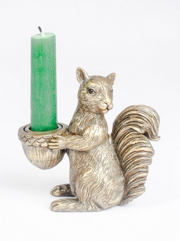 squirrel holding acorn candle holder