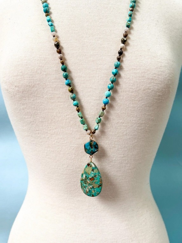 long turquoise necklace with large charm