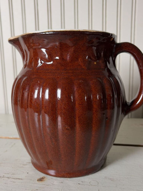 large brown pottery pitcher
