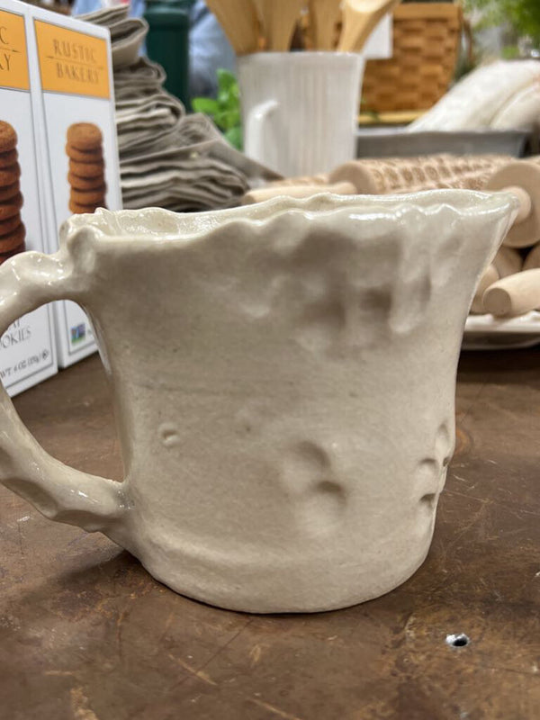 handmade clay pitcher with handle