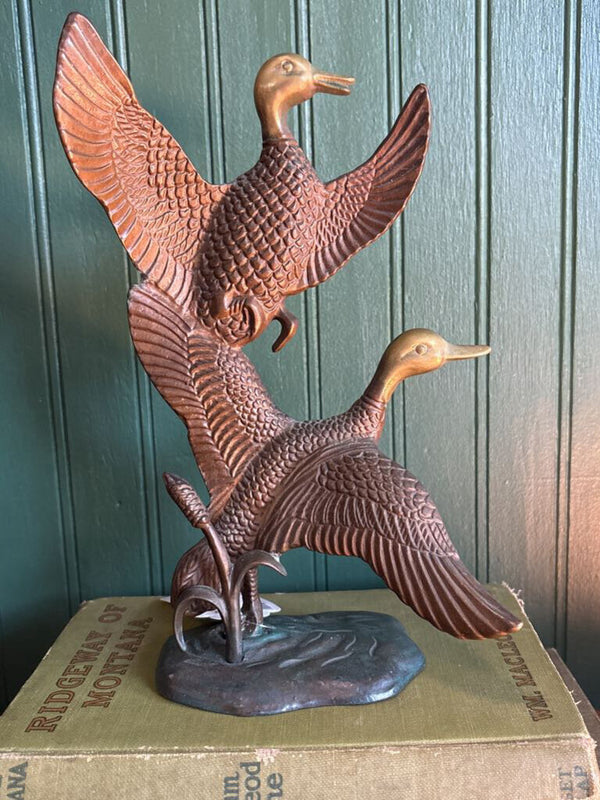 Two Brass Ducks in Flight