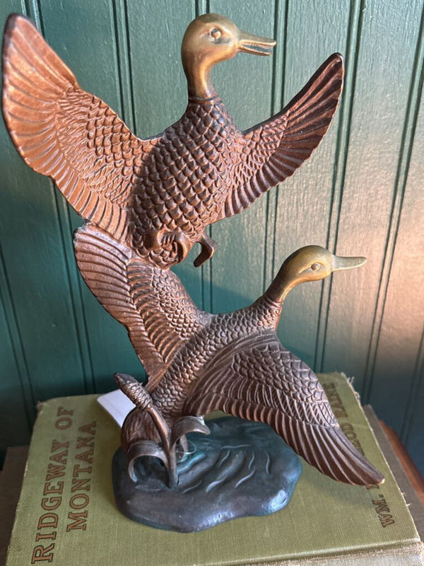 Two Brass Ducks in Flight
