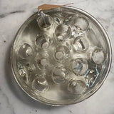 Hefty glass flower frog with edge