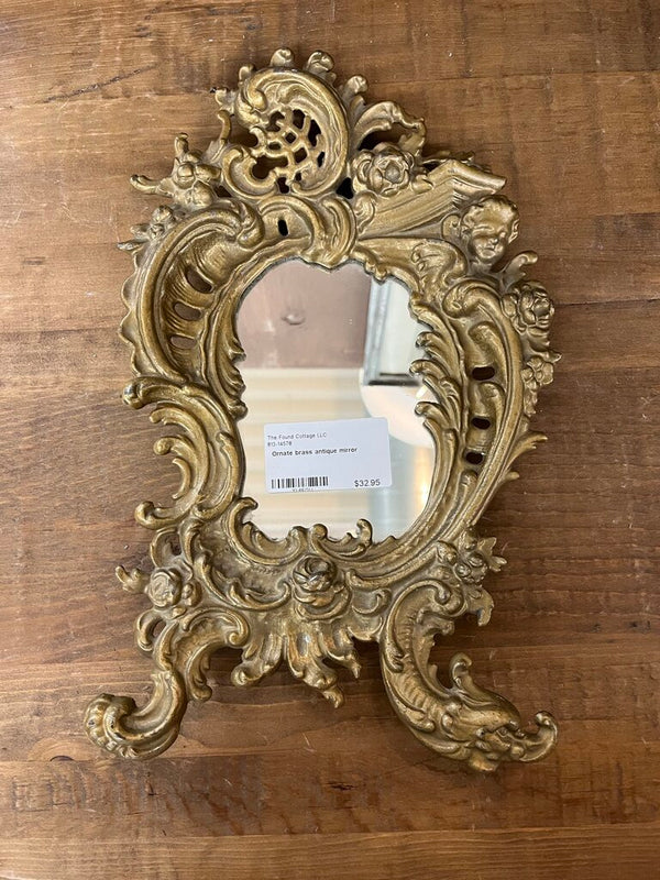 Ornate brass antique mirror
