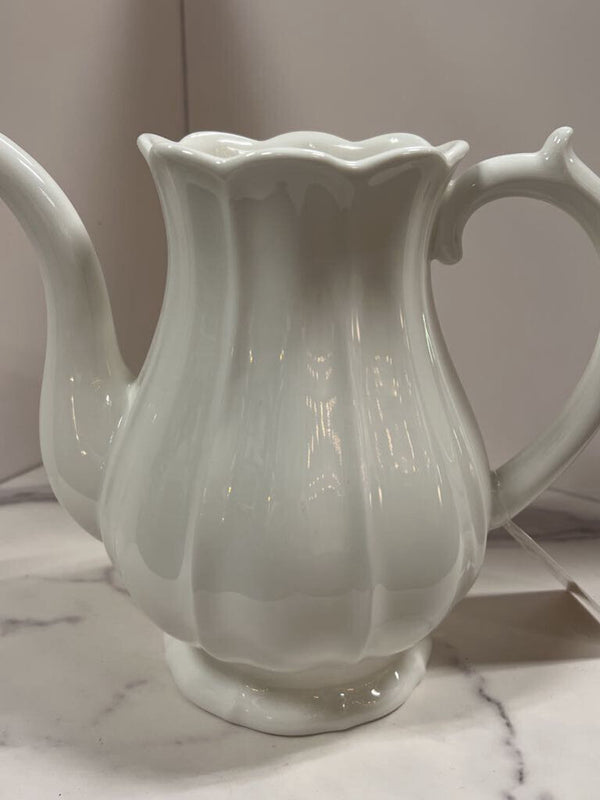white ribbed pottery pitcher