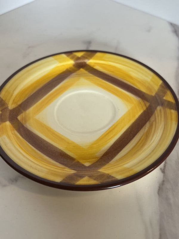 brown and yellow plaid cup and saucer set