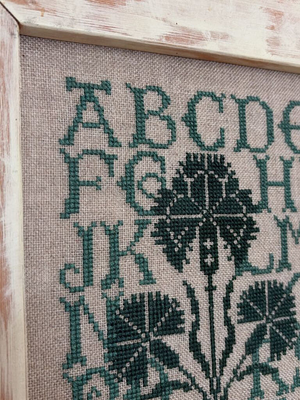 framed green alphabet sampler