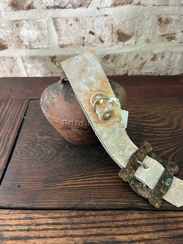 Rusty bell with cowhide strap