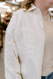 egg shell top with floral pattern sleeves and pockets