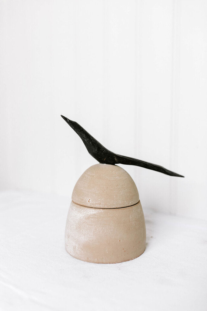 Clay canister with wood bird handle