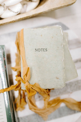 notes oak green paper with camel ribbon