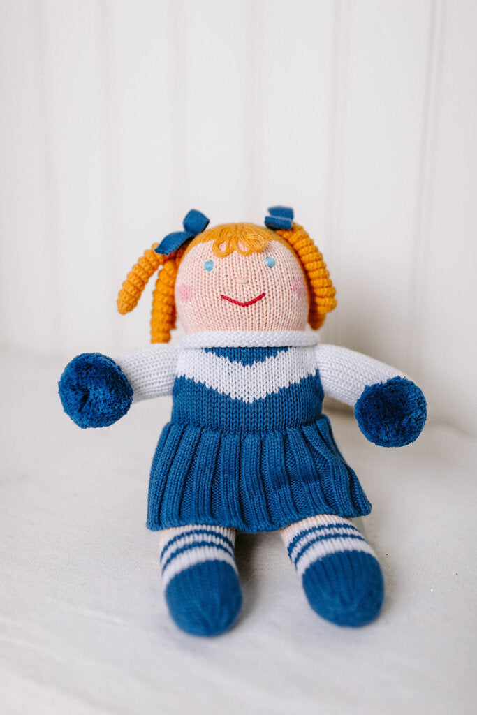 royal blue and white cheerleader doll