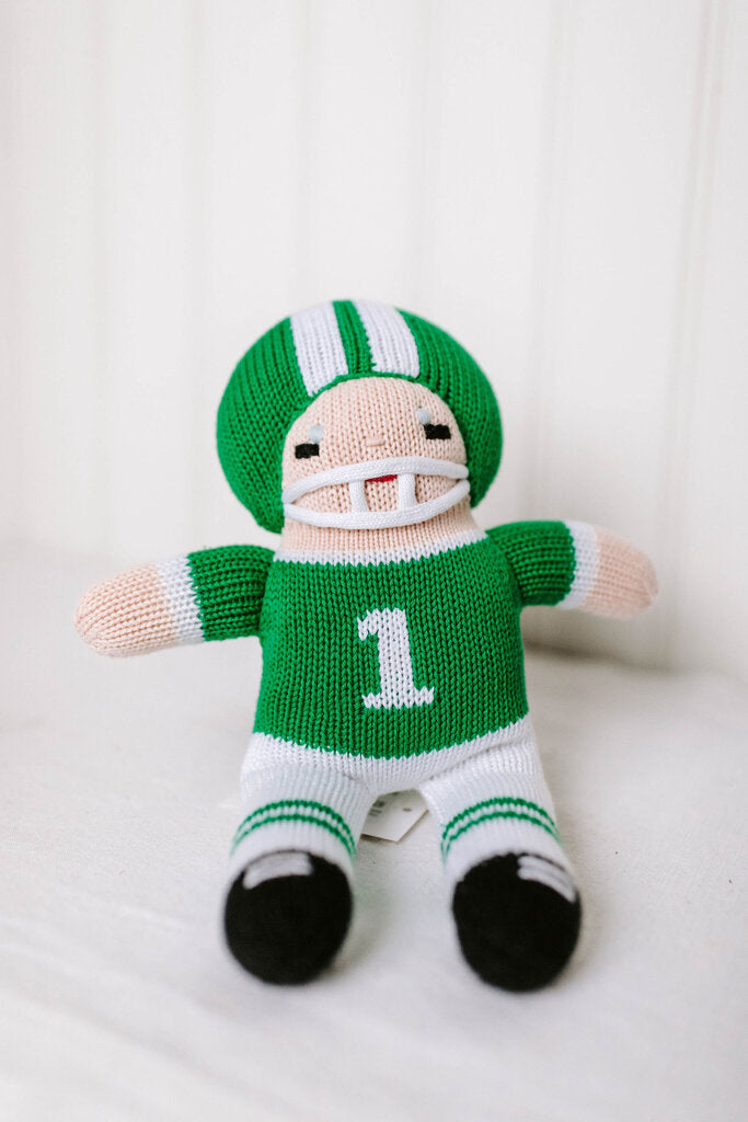 green and white knit football player doll