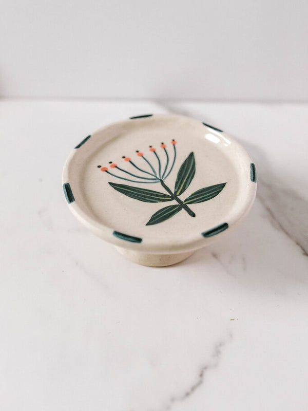 stoneware floral footed dish with blue edge