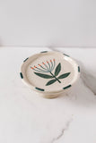 stoneware floral footed dish with blue edge