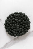 blue round felt ball trivet