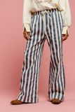 denim and off white striped pants with draw string waist