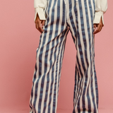denim and off white striped pants with draw string waist
