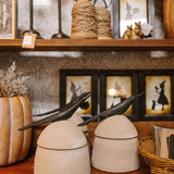 large clay canister with wood bird handle