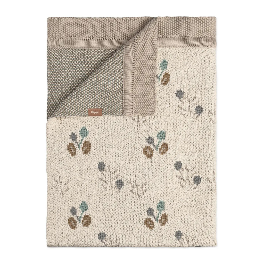 organic cotton poppy print knitted baby blanket
