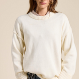 ecru sweater with ribbed crew neckline and ribbed sleeve cuffs