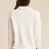 ecru sweater with ribbed crew neckline and ribbed sleeve cuffs