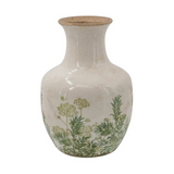 white ceramic vase with green floral motif