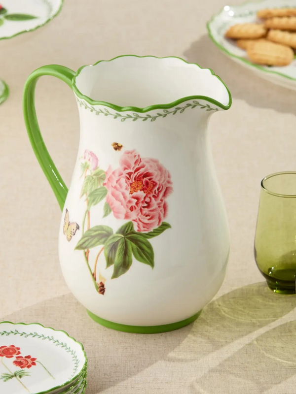 pitcher with floral pattern and green accents