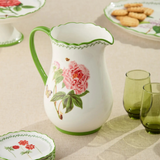 pitcher with floral pattern and green accents