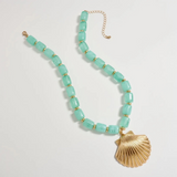 mint chunky beaded necklace with large gold seashell pendant
