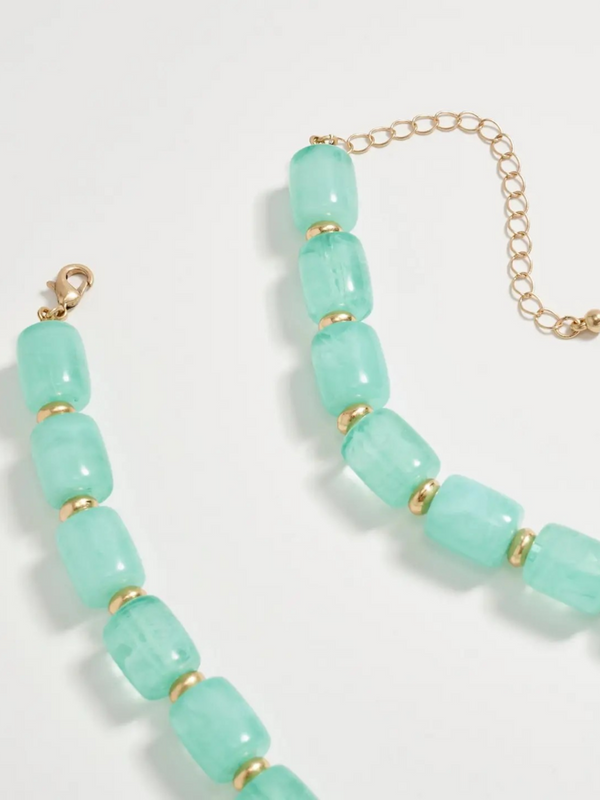 mint chunky beaded necklace with large gold seashell pendant