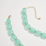 mint chunky beaded necklace with large gold seashell pendant