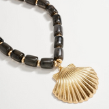 black chunky beaded necklace with large gold seashell pendant