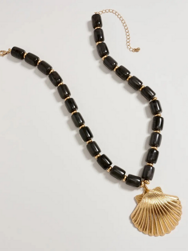 black chunky beaded necklace with large gold seashell pendant
