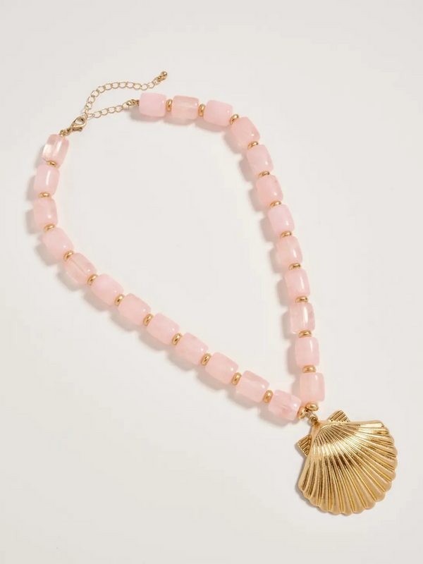 pink chunky beaded necklace with large gold seashell pendant