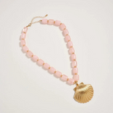 pink chunky beaded necklace with large gold seashell pendant