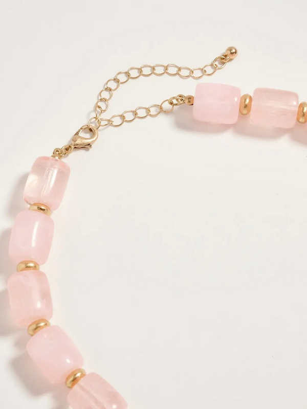 pink chunky beaded necklace with large gold seashell pendant
