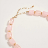 pink chunky beaded necklace with large gold seashell pendant