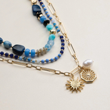 blue layered beaded and chain necklace with sun and pearl charms