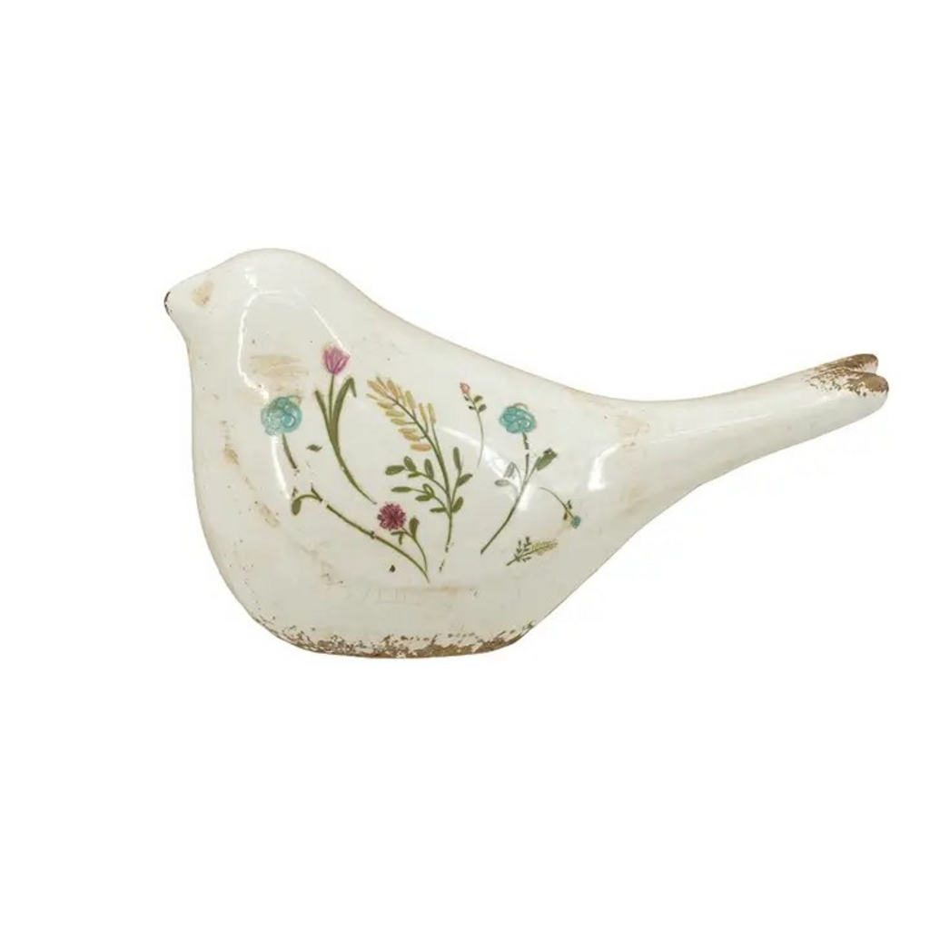 ceramic bird figurine with floral motif