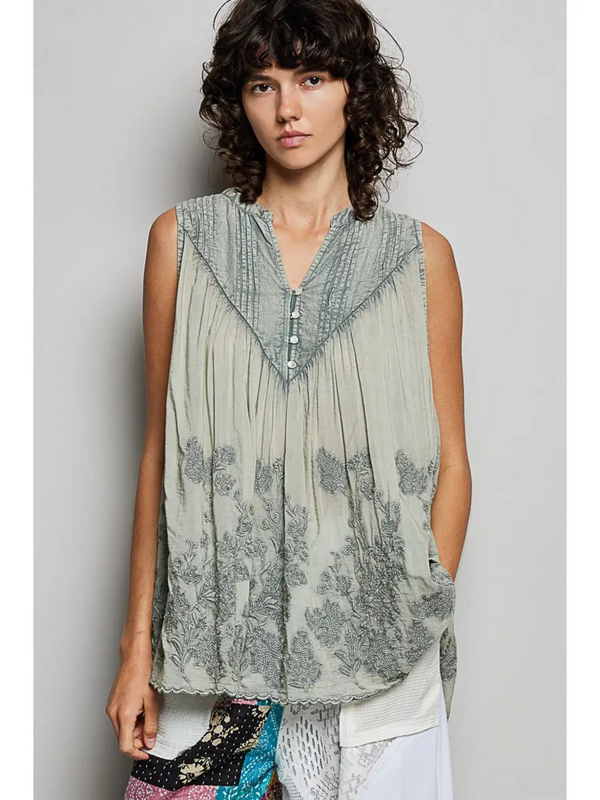 gray sheer sleeveless top with floral details