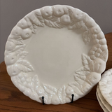 set of four white fruit border plates