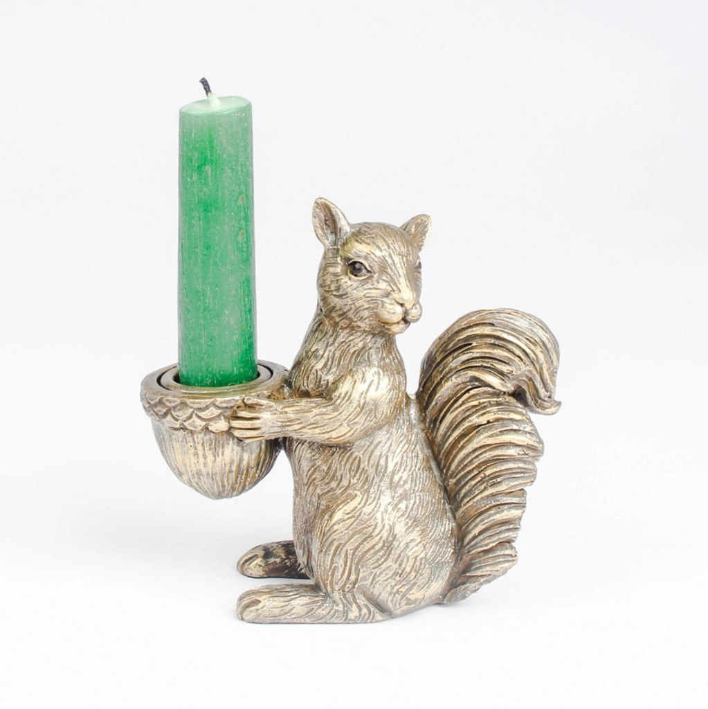 squirrel holding acorn candle holder