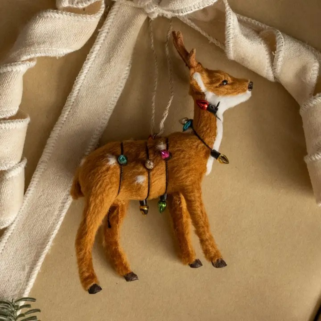 fur deer wrapped in christmas lights ornament